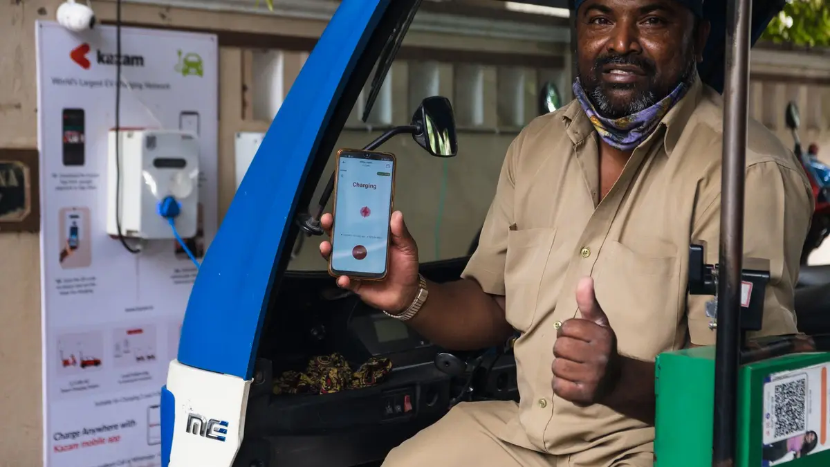 Homeowner controlling a smart EV charger from a phone app in Sydney