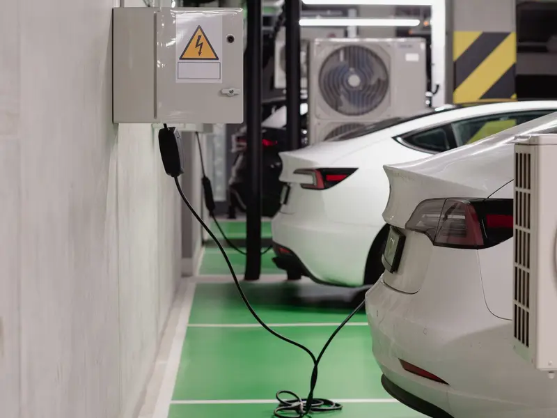 Tesla Wall Connector installed on rendered carport wall in Parramatta